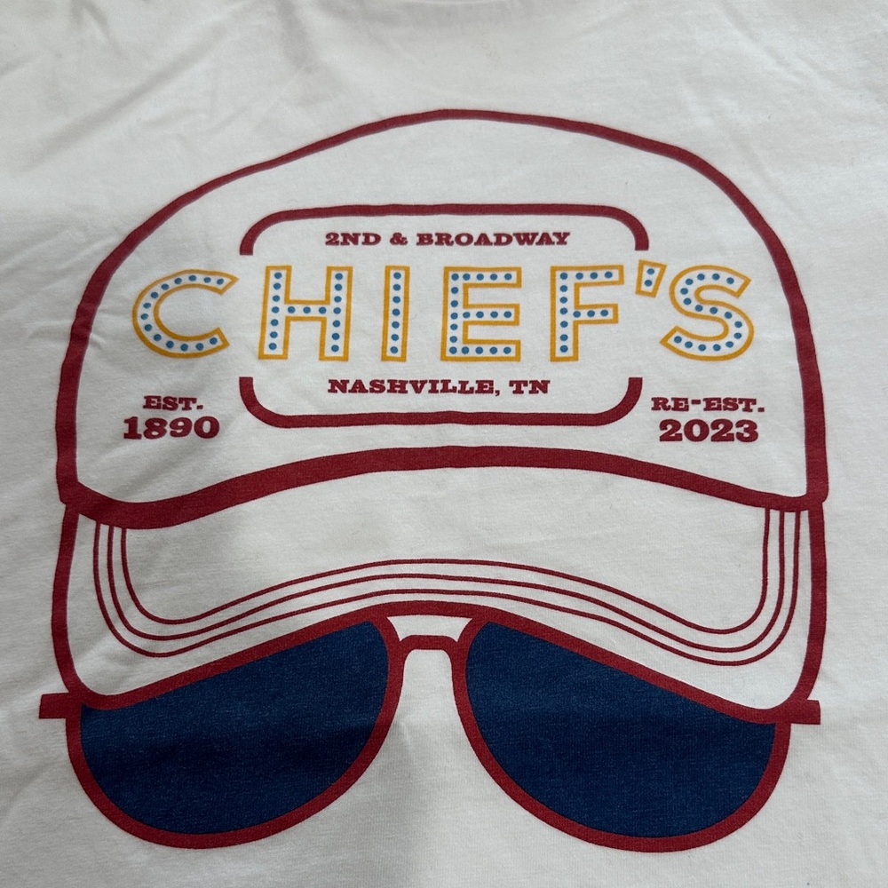 Eric Church Youth LG White Graphic T-Shirt with Red and Blue Design. Chiefs Bar